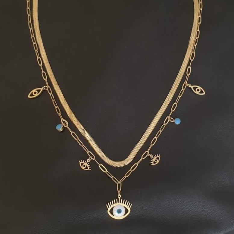 collier double chaîne, couleur or, avec des pendentifs oeil bleu